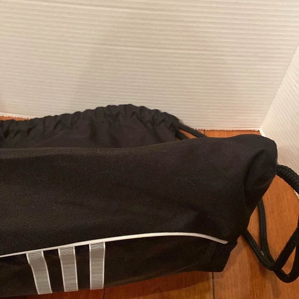 Adidas  black w/ 3 gray stripe polyester Drawstring Backpack front zip pocket
